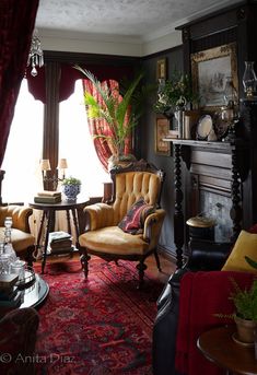 a living room filled with furniture and a fire place in front of a large window