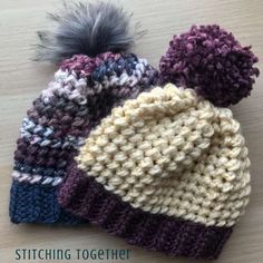 three crocheted hats sitting on top of a wooden table