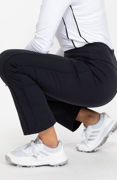 Lightweight, UPF-protective Italian fabric brings moisture-wicking comfort to stretchy, ankle-cropped golf pants featuring a smoothing wide waistband. 26" inseam; 14 1/2" leg opening; 9 1/2" front rise; 12" back rise   UPF 50+ sun protection   Moisture-wicking fabric engineered for dryness and comfort   Antimicrobial fabric engineered to inhibit the growth of odor-causing germs   65% recycled nylon, 35% Lycra® spandex   Dry clean or machine wash, tumble dry   Imported Stretch Athleisure Bottoms For Golf, Athleisure Stretch Bottoms For Golf, Fitted Athleisure Bottoms For Golf, Casual Stretch Golf Pants, Casual Stretch Pants For Golf, Stretch Moisture-wicking Golf Bottoms, Mid-rise Moisture-wicking 4-way Stretch Bottoms, Moisture-wicking Stretch Golf Bottoms, Black 4-way Stretch Go-dry Pants