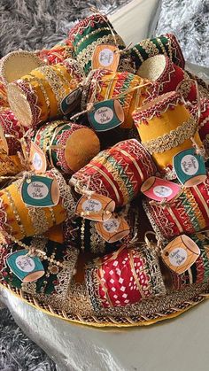 a bowl filled with lots of different colored ribbons