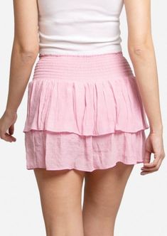 Light pink ruffle tiered mini skirt with elastic waistband 65% Viscose 35% Polyester Size: S/M (14" long), L/XL (15" long) Waist stretch length: 4" Chic Pink Tiered Bottoms, Pink Tiered Bottoms With Layered Hem, Tiered Ruffled Mini Skirt In Pink, Pink Tiered Ruffle Skirt, Tiered Layered Hem Feminine Bottoms, Feminine Tiered Bottoms With Layered Hem, Tiered Pink Mini Skirt With Ruffles, Feminine Tiered Ruffled Skirt, Pink Tiered Ruffle Mini Skirt