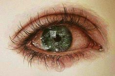 an eye is shown with tears on the iris and part of it's eyelashes