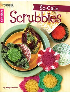 crochet so - cute scrubbies book on a table with plates and bowls