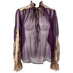 SALVATORE FERRAGAMO top comes in a eggplant silk featuring a gold tone lace design, ruffled hem sleeves, and a front self-tie strap. Made in Italy. Very Good Pre-Owned Condition. Marked: 38 Measurements: Shoulder: 15.5 inches Bust: 42 inches Sleeve: 26 inches Length: 23.5 inches Reference: 122269 Category: Dress Top More Details Brand: SALVATORE FERRAGAMO Size: 2 Color: Eggplant Color 2: Gold Fabric: Silk Material: Chiffon Pattern: Lace Style: Blouson Age Group: Adult Gender: Female Wizard Vibes, Magic Clothes, Eggplant Color, Illustration Fashion Design, Blouson Dress, Silk Lace, Gold Silk, Vintage Lingerie, Lace Fashion