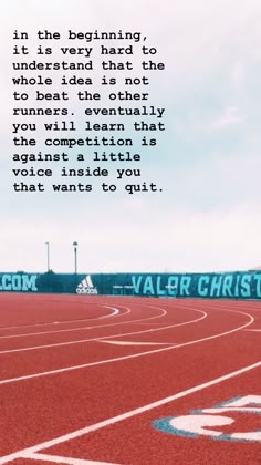 a red running track with the words valor christian on it and a blue sky background