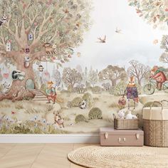 a child's room with a wall mural and basket on the floor