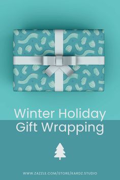 a gift wrapped in blue wrapping paper with white ribbon on it and the words winter holiday gift