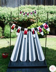 an inflatable race track with the word finish on it and bunting flags