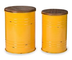 two yellow barrels sitting next to each other