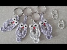 crochet owl keychains and scissors are on the floor next to each other