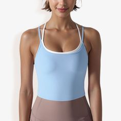 The Anna-Kaci Women's Double Strap Athletic Crop Tank Top with Built-In Bra is a stylish and practical addition to your activewear collection. This crop top features a sleek, double strap design that provides both support and a modern, sporty look. The built-in bra ensures added comfort and convenience, making it perfect for low to medium-impact workouts like yoga, Pilates, or strength training. Crafted from soft, stretchy fabric, this tank top offers a snug, flattering fit that moves with you d Compressive Gym Top With Built-in Bra, Sleeveless Sportswear Tops With Built-in Bra, Athletic Fit Tops With Built-in Bra For Workout, Athleisure Tops With Built-in Bra For Training, Blue Sleeveless Activewear With Built-in Bra, Sporty Top With Built-in Bra For Yoga, Functional Tops With Built-in Bra And Compressive Fit, Functional Compressive Top With Built-in Bra, Sporty Tops With Built-in Bra For Sports