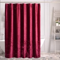 a red shower curtain in a bathroom with white walls and tile flooring on the floor