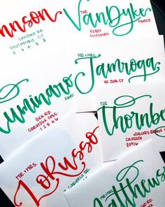 four handwritten christmas cards with the names of each holiday season in green and red