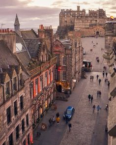 an aerial view of people walking on the street in edinburgh, scotland at sunset or dawn