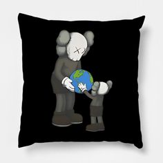 a black pillow with an image of a person holding the earth