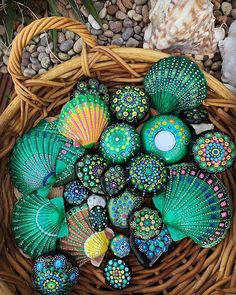 many colorful shells in a wicker basket