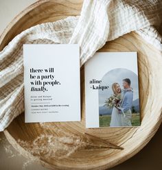 two wedding cards on top of a wooden bowl