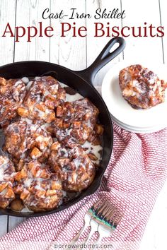 cinnamon apple pie biscuits in a cast iron skillet on a red and white towel