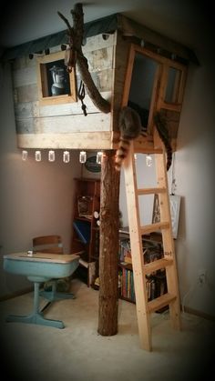 there is a loft bed with a ladder to the top