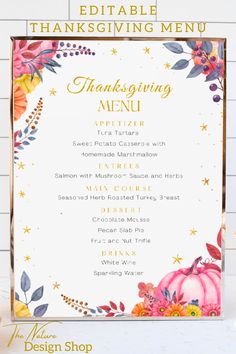 a thanksgiving menu with flowers and leaves on it