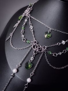 *.~ A delicate looking, multi chain necklace adorned with gorgeous green hearts and steel leaves. Perfect look for any fantasy outfit for even day to day! ~.* *.~ Handmade stainless steel necklace with green crystal glass hearts, faux pearls and glass beads *.~ 15" necklace with a 1.75" extension *.~ Please check measurements first before buying *.~ Colours may differ on screen and in life *.~ Shipping will be sent tracked and signed internationally, and 1st class signed UK. Green Metal Chain Jewelry, Green Metal Necklace With Adjustable Chain, Green Metal Chain Necklace With Adjustable Chain, Green Stainless Steel Jewelry With Adjustable Chain, Elegant Green Stainless Steel Necklace, Green Metal Clavicle Chain Jewelry, Green Delicate Chain Jewelry For Party, Green Metal Clavicle Chain Necklace, 15 Necklace