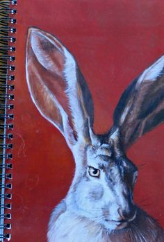 a painting of a bunny rabbit on a red background, with the head turned to look like it's ears