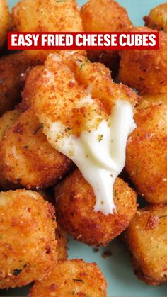 cheese bites on a plate with ranch dressing