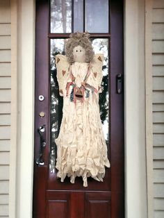 a doll is hanging on the front door