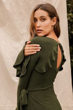 Lulus Exclusive! Cozy and cute will be your middle name with the Lulus Favorite Tune Olive Green Faux Wrap Sweater Dress! Soft and stretchy marled knit shapes a rounded neckline and fitted long sleeves with flounce cuffs. Fitted bodice and waist sit above an A-line mini skirt with an overlapping panel with a tying detail at the side that creates a faux wrap look. Back keyhole with top button and hidden zipper/clasp. Fit: This garment fits true to size. Length: Mid-thigh. Size small measures 35.5 Flounce Sleeve Dress, Green Wrap Dress, Green Sweater Dress, Wrap Sweater Dress, Olive Green Sweater, Middle Name, A Line Mini Skirt, Flounce Sleeve, Rounded Neckline