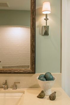 a white bowl filled with eggs sitting on top of a bathroom counter