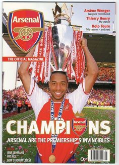 a man holding up a trophy on top of a magazine cover