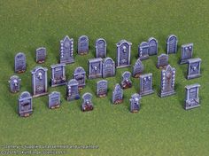 a bunch of tombstones sitting on top of a green field next to each other