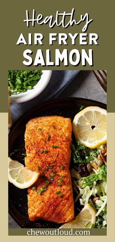 healthy air fryer salmon on a plate with lemons and salad