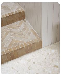 the steps are made of stone and have herringbone pattern