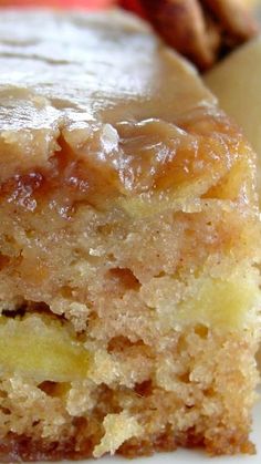 a piece of cake sitting on top of a white plate next to an apple slice