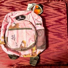 Realtree Game Winner. Medium Pink Backpack. New With Tags. Measurements In Last Picture. Pink Bags For Outdoor And Back To School, Pink Standard Backpack For Outdoor, Pink Backpack For Outdoor, Carhartt Double Knee Pants, Camo Backpack, Blue Coach, Realtree Camo, Medium Backpack, Tie Front Cardigan