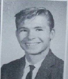 a black and white photo of a man in a suit