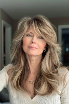 Click for More ➡️ | Save for Later ❤️  Curtain bangs paired with a layered cut create a soft, romantic look. This style works well with both straight and wavy hair, and adding soft highlights can make it more dynamic. (Layered Cut with Curtain Bangs - Long Hairstyles For Women Over 40) Long Bangs With Layered Hair, Long Layered Haircuts Over 50, Sweep Bangs Long Hair, Layered Medium Hair With Curtain Bangs, Hairstyle For Women Over 40, Curtain Fringe Long Hair, Long Hair With Curtain Bangs And Layers, One Side Up Hairstyles, 70s Feathered Hair