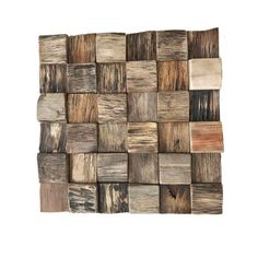 a wooden wall sculpture made out of wood planks with different colors and patterns on it