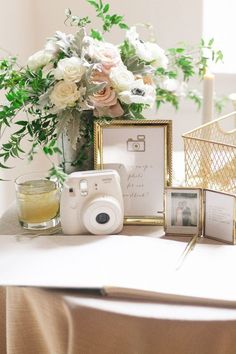 a table with flowers and pictures on it