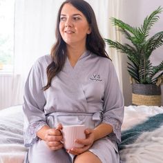 If you’re looking for something to wear when you want a pamper evening to yourself or maybe want to gift your bridal party with something stylish and sophisticated with a personal touch, then our personalised monogram satin dressing gown is just what you’re looking for.The silky feel robe comes in a knee length design with three quarter length sleeves and is available in four stylish shades to suit every taste, ivory, navy, silver and blush pink, all featuring a lace trim on the sleeves and hem. Pamper Evening, Bride Dressing Gown, Monogram Robes, Satin Dressing Gown, Personalized Robe, Girls Robes, Bridesmaid Dressing Gowns, Bridal Party Robes, Gown Bridal