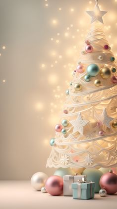 a white christmas tree surrounded by presents and lights in front of a beige background with stars