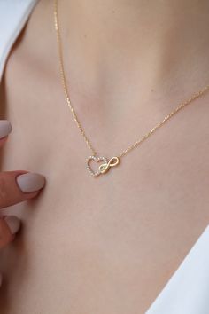 Love can be found even in the smallest details. This infinity heart necklace may seem like a small detail, but it definitely carries the biggest meaning. It is the most elegant representative of immortal love. DETAIL * Made to order. * 100% 14K Solid Gold * Gold Color Selection: Yellow Gold, Rose Gold, White Gold * Cubic zirconia * Pendant Lamp Height: 21 mm / 0.82 inch * Pendant Width: 12 mm / 0.47 inch * Length: 14", 16", 18", 20", 22" (I have a little note in the photos that may help you.) * Luxury Open Heart Necklace For Women, Luxury Minimalist Heart-shaped Necklace, Mother Daughter Dates, Intertwined Hearts, Gold For Women, Infinity Heart, Infinity Necklace, Small Detail, Beautiful Packaging