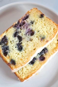 Two slices of blueberry lemon bread with lemon glaze.