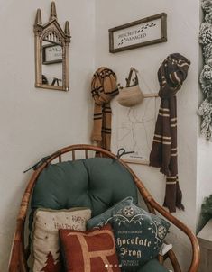 a chair with many pillows on top of it in front of a wall mounted clock