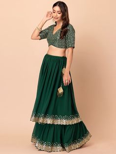 Introducing our amazing green sequins georgette reception wear lehenga choli, a stunning ensemble designed for those special occasions that deserve nothing but the best. This exquisite lehenga choli set will make you the center of attention at receptions, weddings, festivals, and parties, ensuring you look effortlessly stylish and elegant.
Crafted with precision and attention to detail, this green lehenga features a beautiful georgette material that drapes gracefully, enhancing your silhouette. Green Chinon Sharara For Party Wear, Anarkali Green Lehenga With Sequins, Green Embellished Sharara For Party, Green Georgette Party Wear Sets, Sequin Georgette Sharara For Navratri, Designer Green Sequined Lehenga, Diwali Sequin Georgette Set, Festive Green Lehenga With Sequins, Green Chinon Party Wear Sets