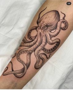 an octopus tattoo on the arm