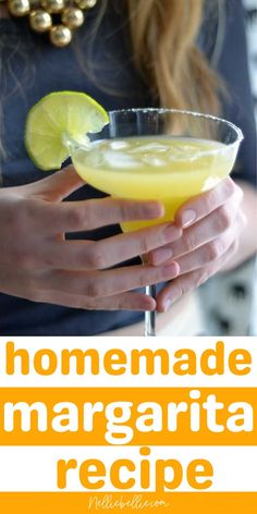 a woman holding a margarita in her hand with the text homemade margarita recipe on it