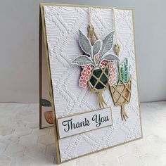 a thank you card with some flowers on it