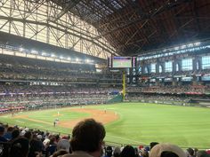 a baseball stadium filled with lots of people